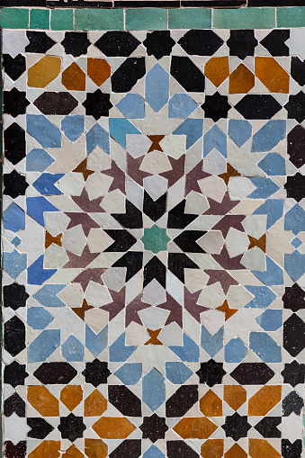 Ancient Arabian tile pattern on a wall with star shape close up detail