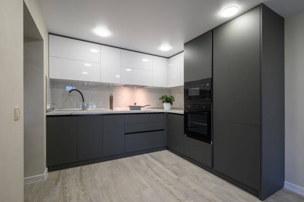 istock Modern simple trendy dark grey and white kitchen 1411104656