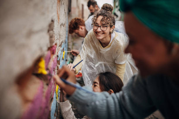 istock Street artists painting on wall 1411107584