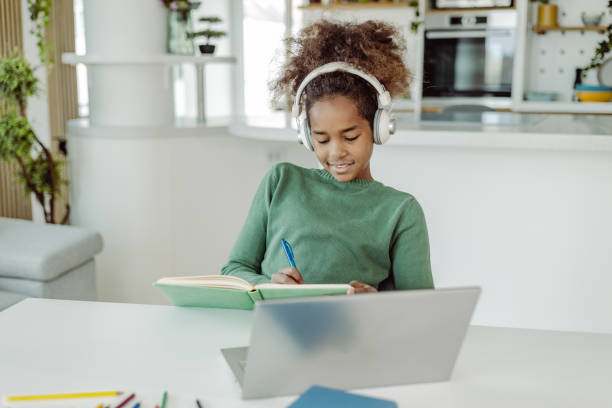istock A little girl is writing homework 1411111140