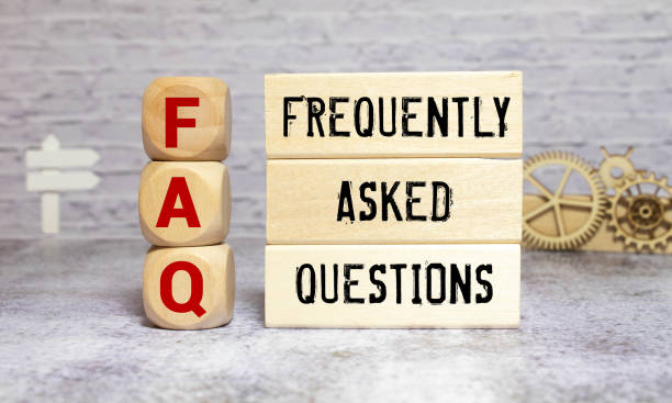 istock FAQ or frequently asked question concept. Wooden blocks with text on desk. 1411111626