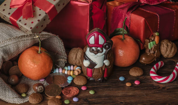 holiday saint nicholas gifts and chocolate - sinterklaas stockfoto's en -beelden
