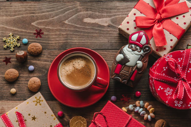 istock Saint Nicholas gift and cup of coffee 1411116225