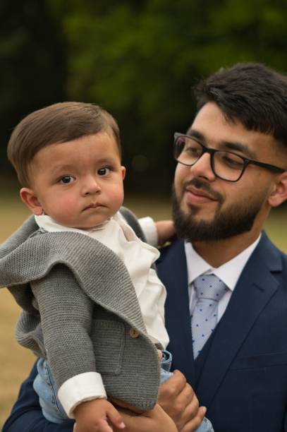 istock Young Asian Father playing with his infant son 1411116345