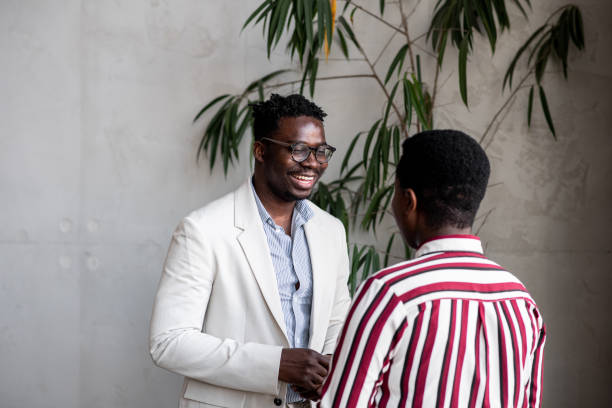 istock Two young black coworkers having a laugh 1411120540
