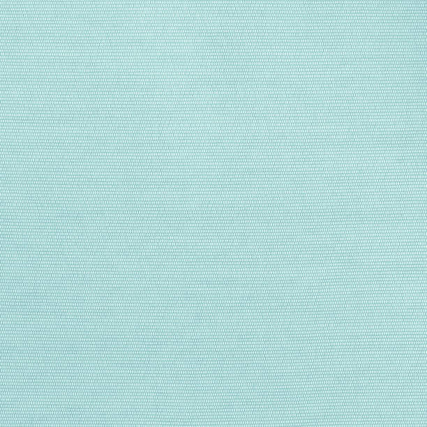 istock Woven cotton linen fabric textile textured backdrop in pastel light blue green color 1411123841