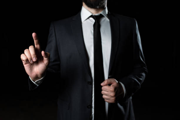 istock Businessman Pointing With One Finger On Important Message. Executive In Suit Presenting Crutial Information. Gentleman Showing Critical Announcement. 1411124761