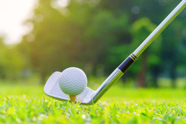 istock Golf ball on green grass ready to be struck on golf course 1411131804