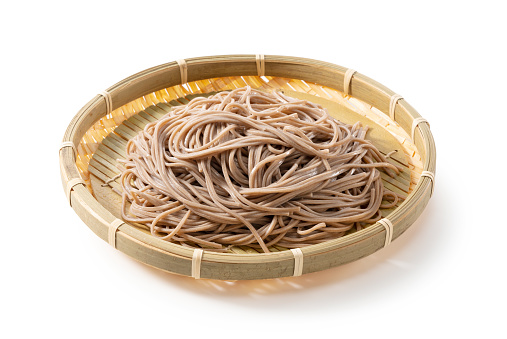 Zaru soba (buckwheat noodles) placed on a white background. Zaru soba is a traditional Japanese food.