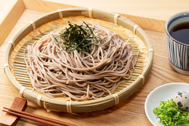 istock Zaru-soba and condiments on a wooden table. 1411133399