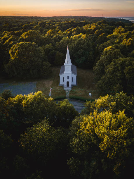 One of the finest examples of an early Victorian church, the South Ferry Church, is located 1000 feet from Narragansett Bay on a hilltop on South Ferry Road in Narragansett, Rhode Island. Designed by Thomas Tefft, a prominent 19th century Providence architect, the South Ferry Church was built in the 1850's for the Narragansett Baptist Church.