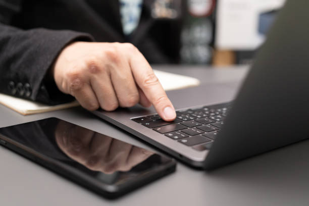 istock working on desk with laptop and smartphone. 1411134545