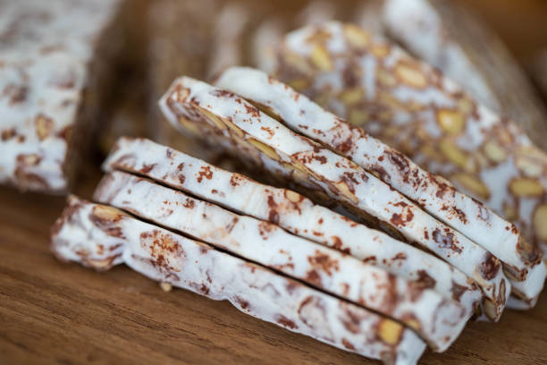 nougat with pistachio side by side. Chewy candy in multi color, Macro picture.