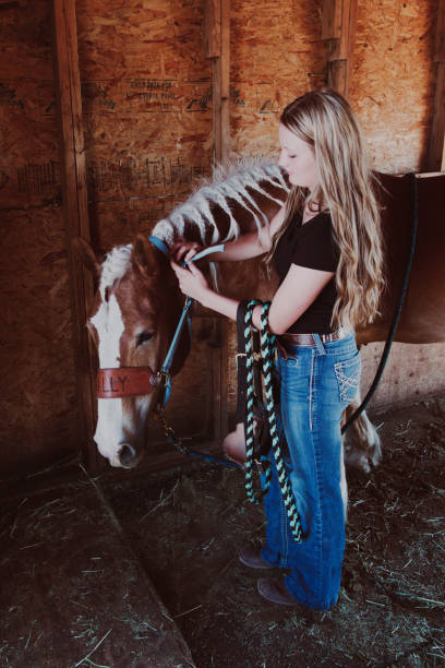 istock Girl with horse 1411137053