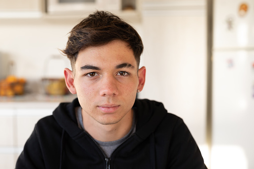 16 years-old teenager looking at camera