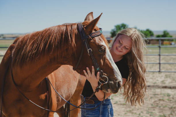 istock Girl with horse 1411138007