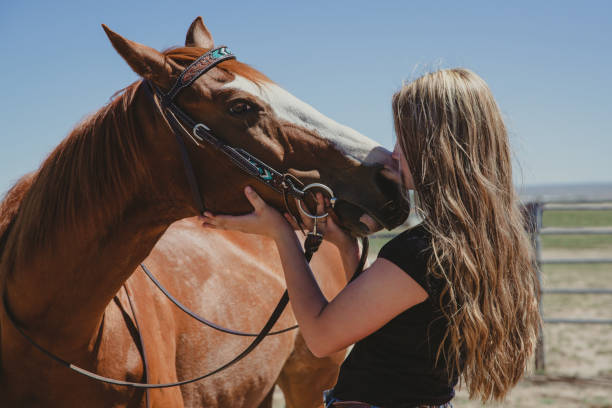 istock Girl with horse 1411138037