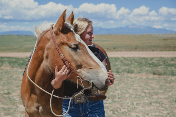 istock Girl with horse 1411138752