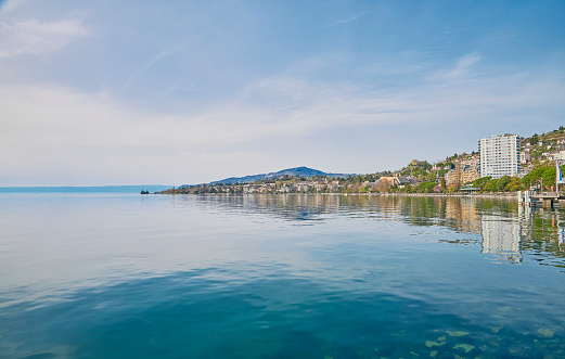A landscape of Lake Geneva on a sunny day from the lakeside promenade at Montreux city, Switzerland