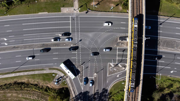 istock Busy Traffic Intersection And Light Rail Bridge Shot From Above 1411145063