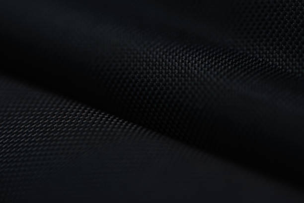 istock Dark texture background of black fabric 1411145248