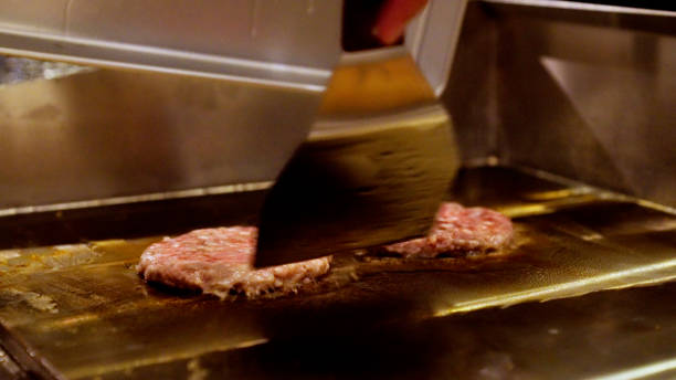 istock Japanese men are making hamburgers. 1411146206