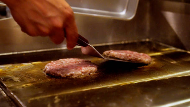 istock Japanese men are making hamburgers. 1411146207