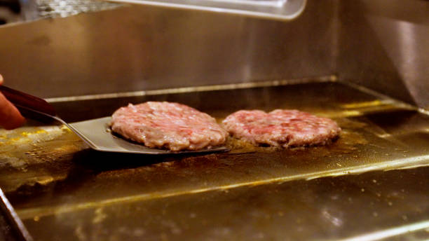 istock Japanese men are making hamburgers. 1411146208
