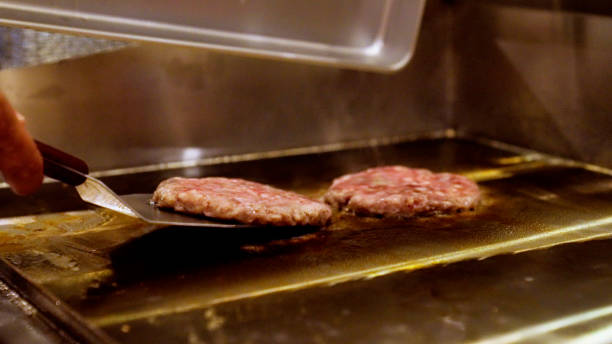 istock Japanese men are making hamburgers. 1411146209