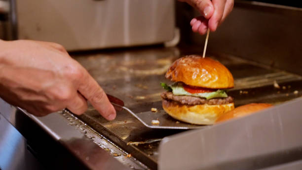 istock Japanese men are making hamburgers. 1411146244