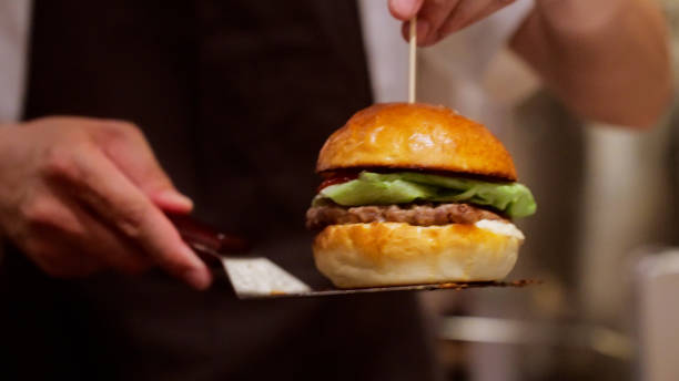 istock Japanese men are making hamburgers. 1411146248