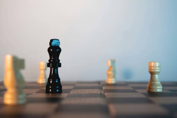 istock Chess game. Black king surrounded by white pieces. 1411149042