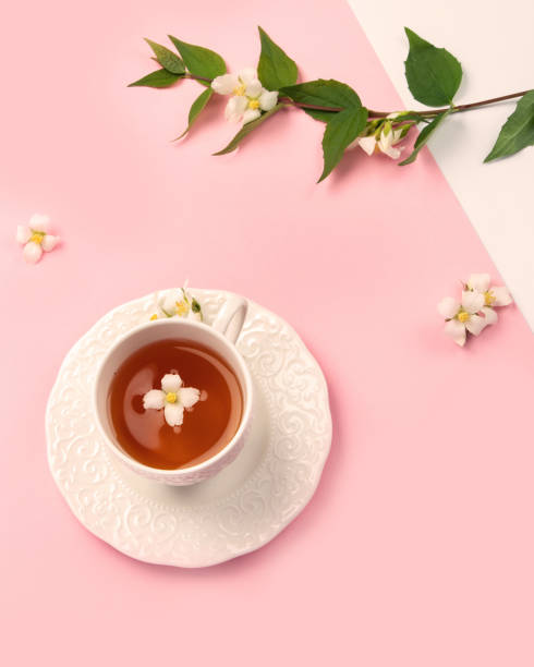 istock Jasmine tea on color background. 1411150153