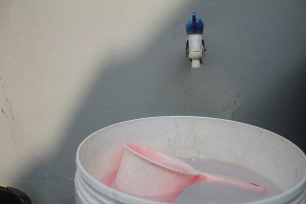 istock plastic buckets and faucets 1411150571