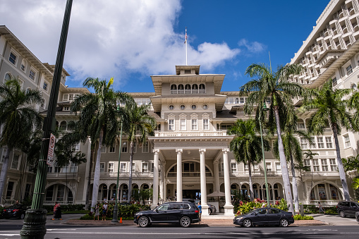 Honolulu, HI - April 29, 2022: The Moana Surfrider Hotel along Kalakaua Avenue in Waikiki. This historic hotel know as \