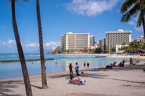 Honolulu, HI - April 29, 2022: View of people enjoying Waikiki Beach.