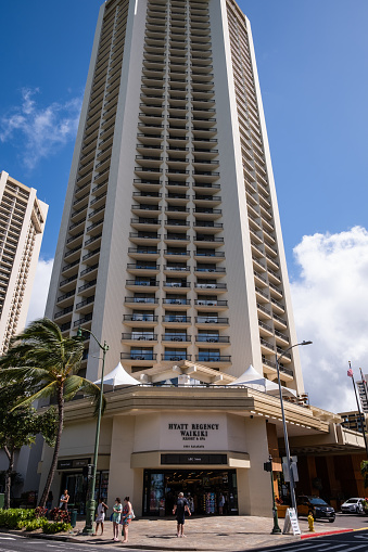 Honolulu, HI - April 29, 2022: The Hyatt Regency and ABC Store along Kalakaua Avenue in Waikiki.