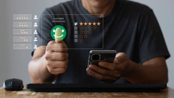 istock Customer review satisfaction feedback survey concept, Man give rating to service experience on  online application, Customer can evaluate quality of service leading to reputation ranking of business 1411155691