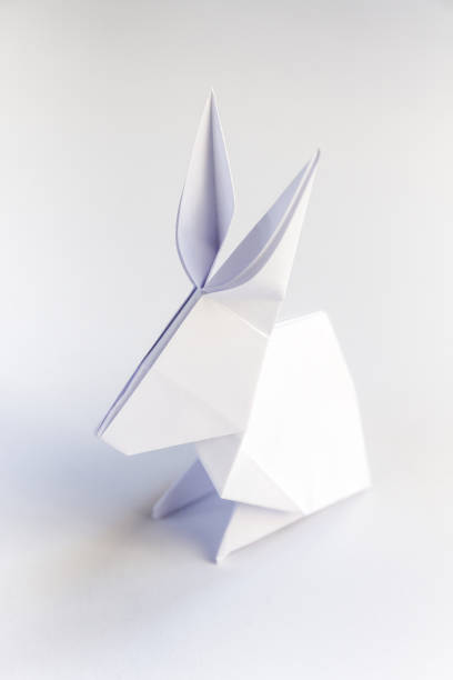 istock Paper rabbit origami isolated on a white background 1411156629