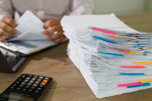 istock Business Documents concept  document achieves on folders papers at busy work desk office 1411157622