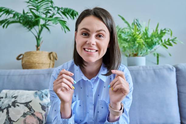 istock Webcam view of young talking female in home office 1411159578