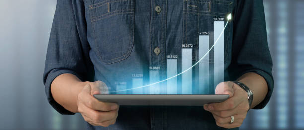 istock Businessman plan graph growth increase of chart positive indicators on tablet in hand 1411162278