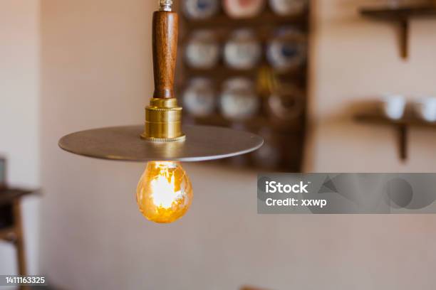 A Chandelier In A Cafe Stock Photo - Download Image Now - Art, Backgrounds, Brass