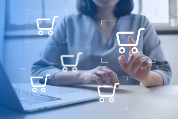istock shopper using laptop and touch virtual screen online shopping. And online payment option or digital wallet online transaction concept. 1411163671