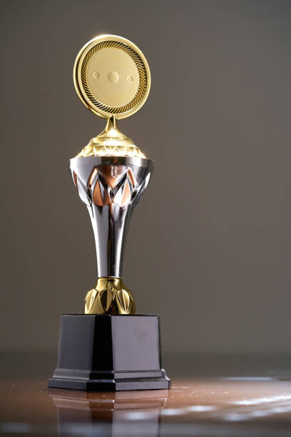 istock gold trophy against white background 1411164800