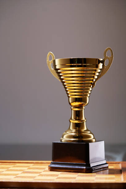 istock gold trophy against white background 1411164810