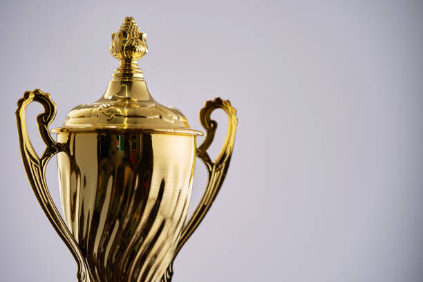 istock gold trophy against white background 1411164819