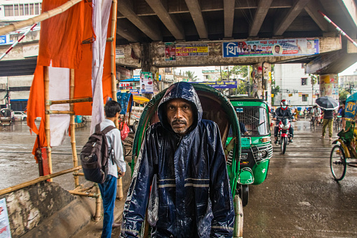 Street people's lifestyles during the rainy seasons.  City people waiting for the rain as the weather is so warm. This photo was taken on 2022-07-20, from Dhaka, Bangladesh, South Asia