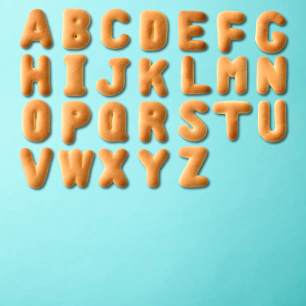 istock Capital letter alphabetical order in cookies on light blue background 1411171578