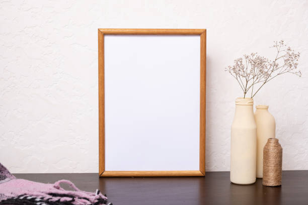 istock Mock up empty wooden frame mockup, dried grass in vases on white background, interior, home design. Art concept. copy space. 1411171682
